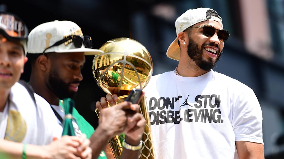 Jun 21, 2024; Boston, MA, USA; Boston Celtics player Jayson Tatum holds the Larry OíBrien trophy during the Boston Celtics Championship parade. Mandatory Credit: Bob DeChiara-Imagn Images Jun 21, 2024; Boston, MA, USA; Boston Celtics player Jayson Tatum holds the Larry OíBrien trophy during the Boston Celtics Championship parade. Mandatory Credit: Bob DeChiara-Imagn Images