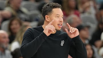 Oct 17, 2025; San Antonio, Texas, USA; San Antonio Spurs head coach Mitch Johnson signals to players during the second half against the Indiana Pacers at Frost Bank Center. Mandatory Credit: Scott Wachter-Imagn Images