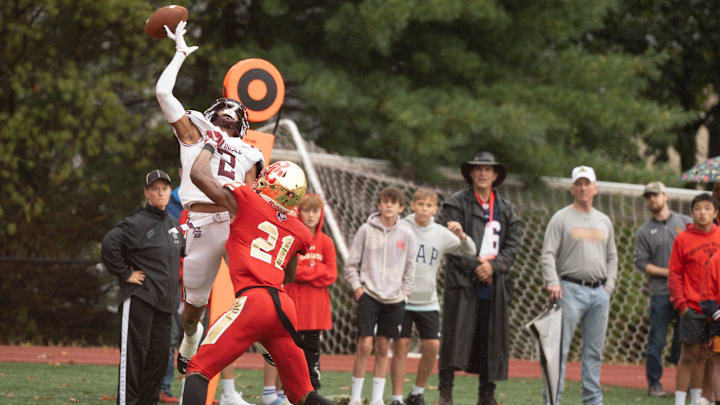 Sep 28, 2024; Oradell, NJ, USA; Don Bosco football at Bergen Catholic. DB #2 Isaiah Alvarez reaches for the ball as BC #21 Jordan Thomas tries to breakup the pass.