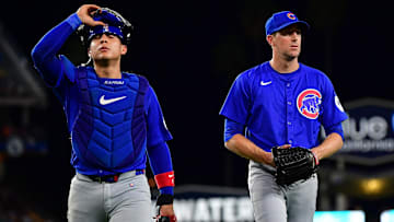 Sep 9, 2024; Los Angeles, California, USA; Chicago Cubs catcher Miguel Amaya (9) and pitcher Kyle Hendricks (28) return to the dugout following the third inning at Dodger Stadium. Mandatory Credit: Gary A. Vasquez-Imagn Images
