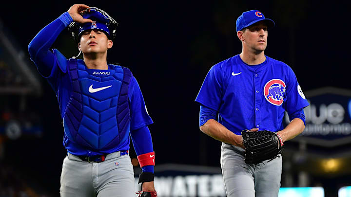 Sep 9, 2024; Los Angeles, California, USA; Chicago Cubs catcher Miguel Amaya (9) and pitcher Kyle Hendricks (28) return to the dugout following the third inning at Dodger Stadium. Mandatory Credit: Gary A. Vasquez-Imagn Images