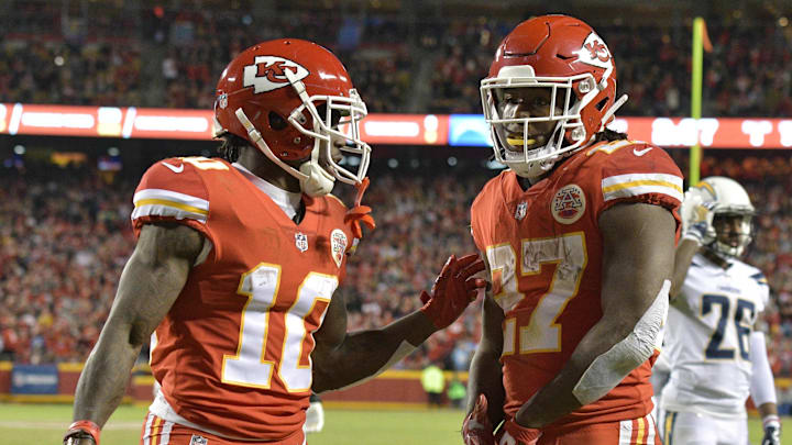 Dec 16, 2017; Kansas City, MO, USA; Kansas City Chiefs running back Kareem Hunt (27) celebrates with wide receiver Tyreek Hill (10) after Hunt scored a touchdown during the second half against the Los Angeles Chargers at Arrowhead Stadium.