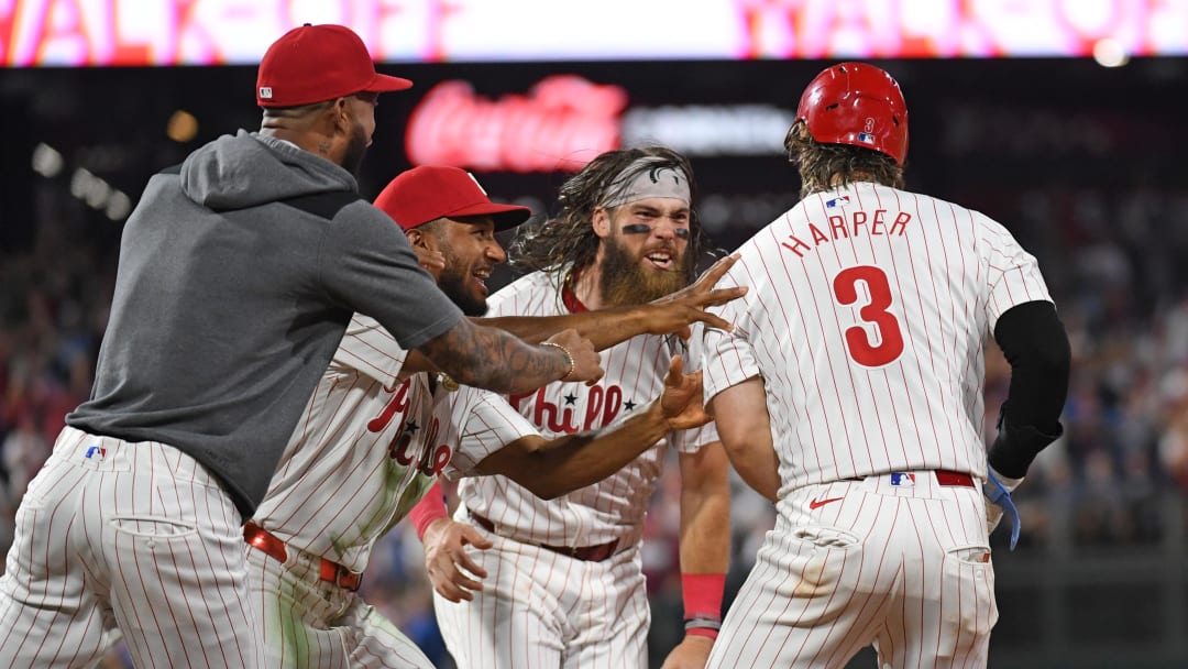 Aug 26, 2024; Philadelphia, Pennsylvania, USA; Philadelphia Phillies first base Bryce Harper (3) celebrates his walk-off single with teammates against the Houston Astros during the tenth inning at Citizens Bank Park.