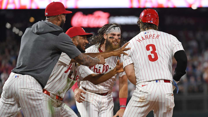 Aug 26, 2024; Philadelphia, Pennsylvania, USA; Philadelphia Phillies first base Bryce Harper (3) celebrates his walk-off single with teammates against the Houston Astros during the tenth inning at Citizens Bank Park.