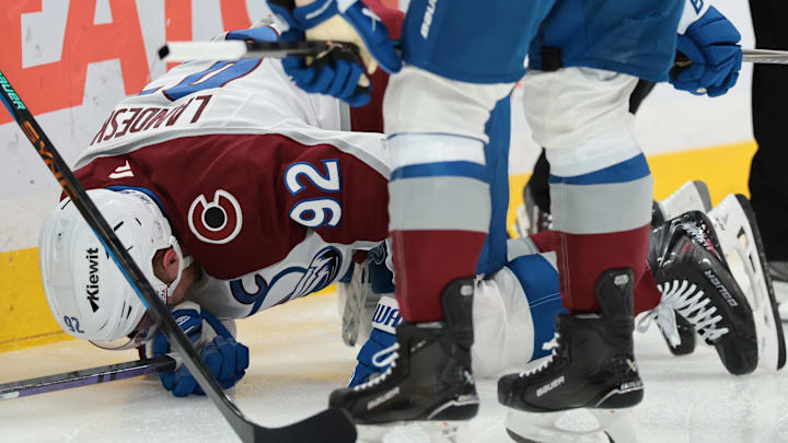 Jan 4, 2026; Sunrise, Florida, USA; Colorado Avalanche left wing Gabriel Landeskog (92) reacts after crashing against the goal post during the second period against the Florida Panthers at Amerant Bank Arena. Mandatory Credit: Sam Navarro-Imagn Images