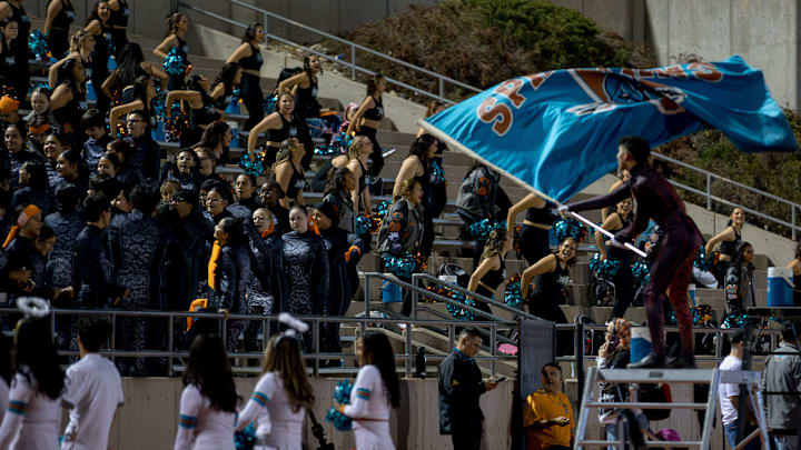 Pebble Hills’ drum major waves a flag as the band plays during a District 1-6A high school football game against Eastlake on Friday, Oct. 31, 2025, at SAC 1 in El Paso, Texas.
