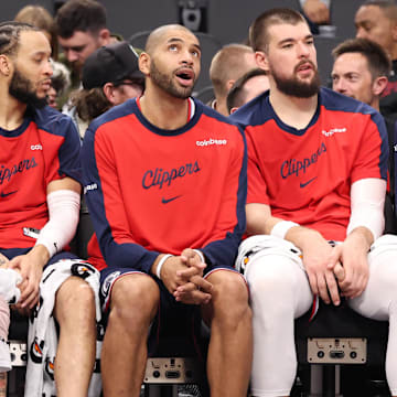 Dec 4, 2024; Inglewood, California, USA;  Los Angeles Clippers guard James Harden (1, left), guard Amir Coffey (7), forward Nicolas Batum (33) and center Ivica Zubac (40, right) watch from the bench during the second half against the Minnesota Timberwolves at Intuit Dome. Mandatory Credit: Kiyoshi Mio-Imagn Images