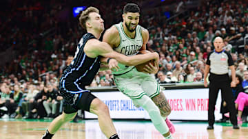 Orlando Magic forward Franz Wagner (22) tries to steal the ball from Boston Celtics forward Jayson Tatum (0) during the second half at TD Garden.
