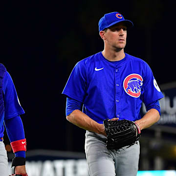 Sep 9, 2024; Los Angeles, California, USA; Chicago Cubs catcher Miguel Amaya and pitcher Kyle Hendricks return to the dugout following the third inning at Dodger Stadium.