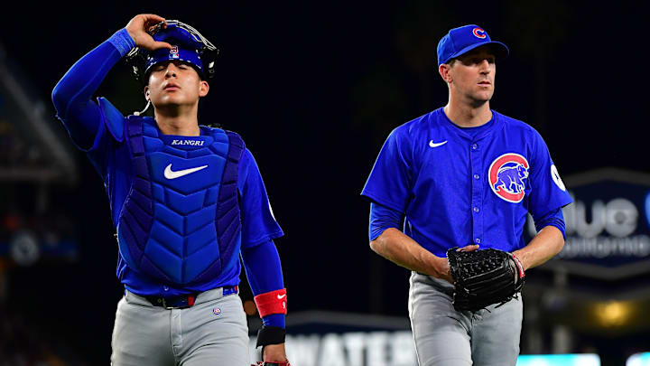 Sep 9, 2024; Los Angeles, California, USA; Chicago Cubs catcher Miguel Amaya and pitcher Kyle Hendricks return to the dugout following the third inning at Dodger Stadium.