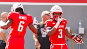 Oct 4, 2025; Raleigh, North Carolina, USA;  NC State Wolfpack running back Hollywood Smothers (3) and wide receiver Wesley Grimes (6) celebrate a touchdown during the first half of the game against Campbell Fighting Camels at Carter-Finley Stadium. Mandatory Credit: Jaylynn Nash-Imagn Images