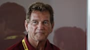 Jul 26, 2018; Richmond, VA, USA; Former Washington Redskins quarterback Joe Theismann listens as Redskins quarterback Alex Smith (not pictured) speaks with the media after practice on day one of Redskins training camp at Bon Secours Washington Redskins Training Cent. Mandatory Credit: Geoff Burke-Imagn Images