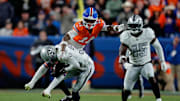 Nov 6, 2025; Denver, Colorado, USA; Las Vegas Raiders cornerback Kyu Blu Kelly (36) makes an interception against the Denver Broncos during the second half at Empower Field at Mile High. Mandatory Credit: Isaiah J. Downing-Imagn Images