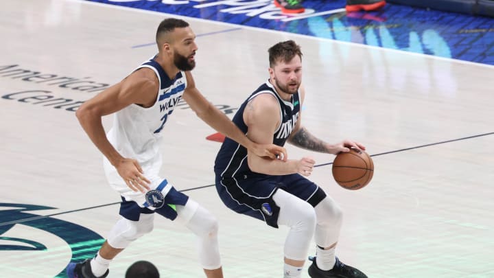 Dallas Mavericks guard Luka Doncic (77) controls the ball against Minnesota Timberwolves center Rudy Gobert (27) in the second quarter during Game 3 of the Western Conference finals at American Airlines Center in Dallas on May 26, 2024. 