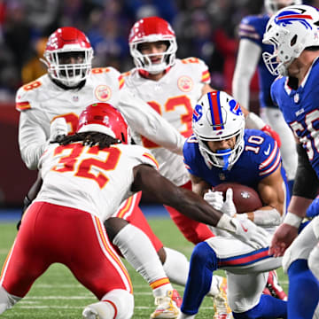Nov 17, 2024; Orchard Park, New York, USA; Buffalo Bills wide receiver Khalil Shakir (10) is tackled by Kansas City Chiefs linebacker Nick Bolton (32) and safety Bryan Cook (6) after making a catch in the third quarter at Highmark Stadium. Mandatory Credit: Mark Konezny-Imagn Images
