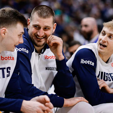 Jan 21, 2025; Denver, Colorado, USA; Denver Nuggets center Nikola Jokic (15) talks with guard Christian Braun (0) and forward Hunter Tyson (5) in the fourth quarter against the Philadelphia 76ers at Ball Arena. Mandatory Credit: Isaiah J. Downing-Imagn Images