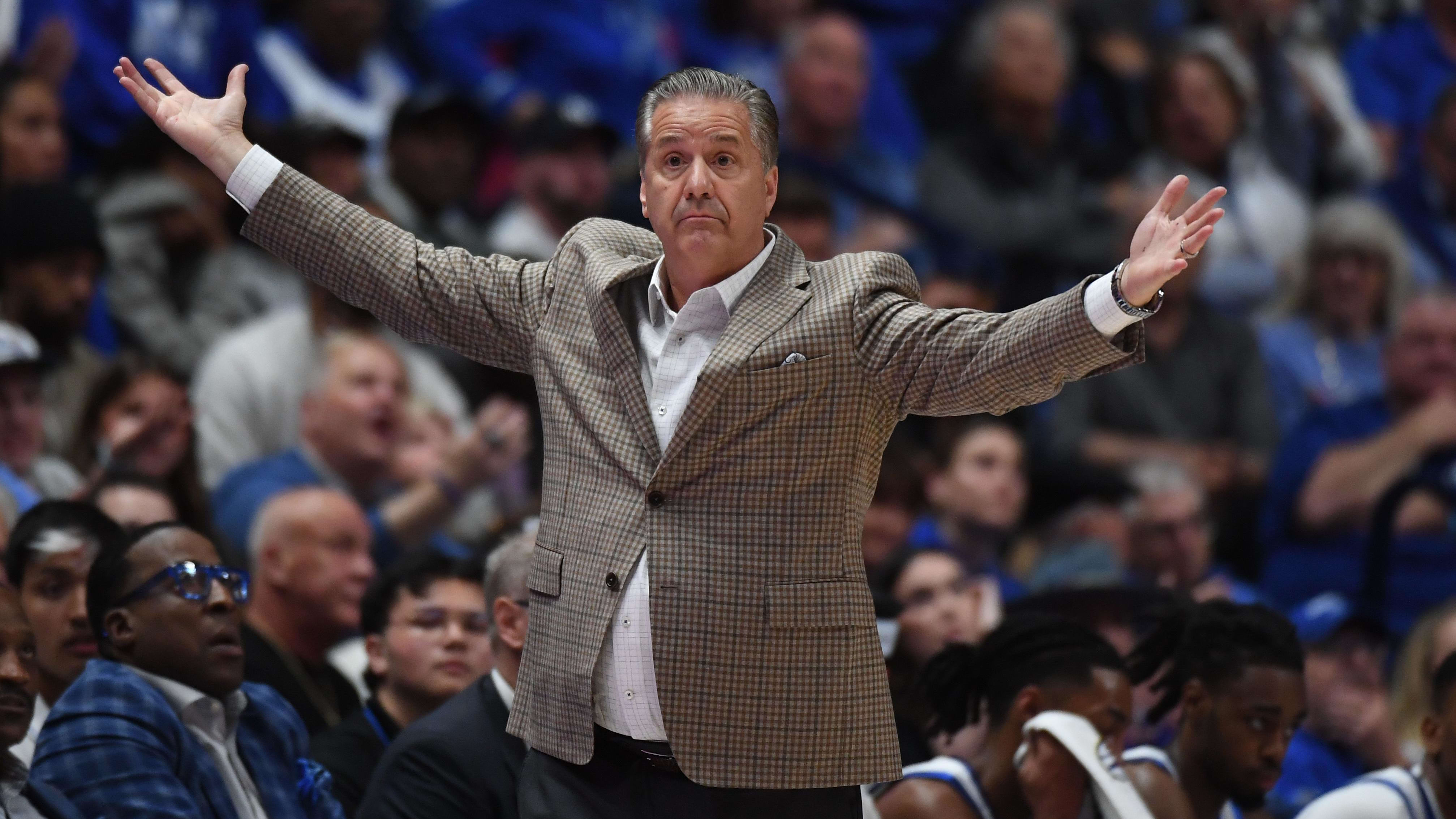 Kentucky Wildcats head coach John Calipari questions a call