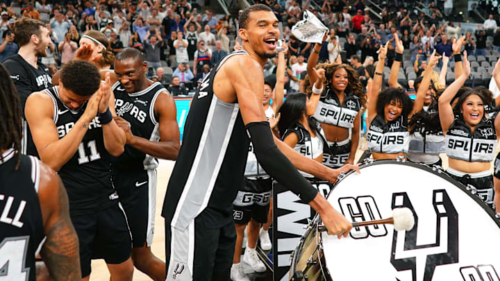 Mar 5, 2026; San Antonio, Texas, USA; San Antonio Spurs forward forward Victor Wembanyama (1) beats a drum and leads fans on a cheer after a victory over the Detroit Pistons at Frost Bank Center. Mandatory Credit: Scott Wachter-Imagn Images