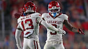 Arkansas Razorback defensive back Larry Worth III (3) and defensive back Kani Walker (13) react during the second quarter against the Mississippi Rebels at Vaught-Hemingway Stadium.