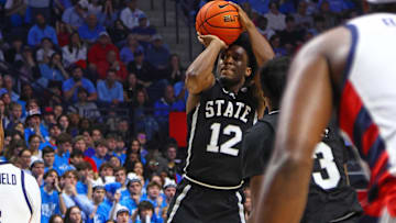 Feb 15, 2025; Oxford, Mississippi, USA; Mississippi State Bulldogs guard Josh Hubbard (12) shoots for three during the first half against the Mississippi Rebels at The Sandy and John Black Pavilion at Ole Miss. Mandatory Credit: Petre Thomas-Imagn Images