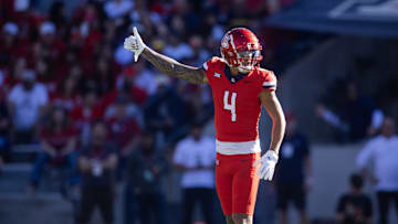 Nov 30, 2024; Tucson, Arizona, USA; Arizona Wildcats wide receiver Tetairoa McMillan (4) against the Arizona State Sun Devils during the Territorial Cup at Arizona Stadium. Mandatory Credit: Mark J. Rebilas-Imagn Images