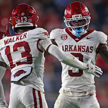 Arkansas Razorback defensive back Larry Worth III (3) and defensive back Kani Walker (13) react during the second quarter against the Mississippi Rebels at Vaught-Hemingway Stadium.