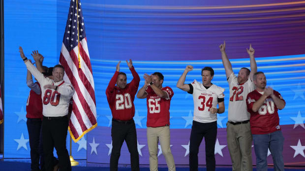 Former Mankato West football players joined former coach, vice presidential hopeful Tim Walz on stage at the DNC on Wednesday