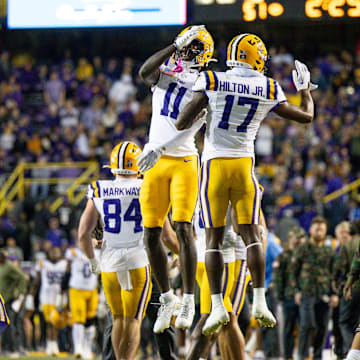 Nov 11, 2023; Baton Rouge, Louisiana, USA;  LSU Tigers wide receiver Chris Hilton Jr. (17) and wide receiver Chris Hilton Jr. (17) react to a touchdown in the final minute against the Florida Gators during the second half at Tiger Stadium. Mandatory Credit: Stephen Lew-Imagn Images