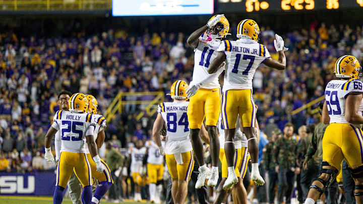 Nov 11, 2023; Baton Rouge, Louisiana, USA;  LSU Tigers wide receiver Chris Hilton Jr. (17) and wide receiver Chris Hilton Jr. (17) react to a touchdown in the final minute against the Florida Gators during the second half at Tiger Stadium. Mandatory Credit: Stephen Lew-Imagn Images