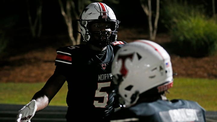 North Oconee's Khamari Brooks (5) celebrate with North Oconee's Braxton Goolsby (4) after scoring a touchdown during a GHSA high school football game against Jefferson in Bogart, Ga., on Friday, Sept. 13, 2024. The undefeated Titans join this week's Top 25 Georgia High School Football Rankings at No. 24.