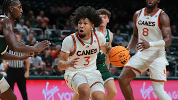 Nov 3, 2025; Coral Gables, Florida, USA; Miami Hurricanes guard Tre Donaldson (3) drives to the basket against the Jacksonville Dolphins during the second half at Watsco Center. Mandatory Credit: Sam Navarro-Imagn Images