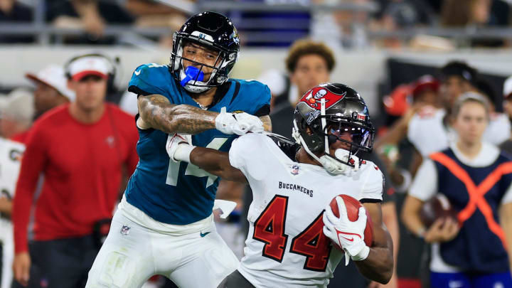 Jacksonville Jaguars wide receiver Elijah Cooks (14) Tampa Bay Buccaneers running back Sean Tucker (44) during the second quarter of a preseason NFL football game Saturday, Aug. 17, 2024 at EverBank Stadium in Jacksonville, Fla. The Jacksonville Jaguars defeated the Tampa Bay Buccaneers 20-7. [Corey Perrine/Florida Times-Union]