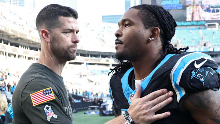 Carolina Panthers head coach Dave Canales and running back Rico Dowdle 