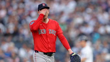 Jun 6, 2025; Bronx, New York, USA; Boston Red Sox starting pitcher Walker Buehler (0) reacts after the first inning against the New York Yankees at Yankee Stadium. Mandatory Credit: Brad Penner-Imagn Images