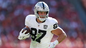 Dec 8, 2024; Tampa, Florida, USA; Las Vegas Raiders tight end Michael Mayer (87) runs with the ball against the Tampa Bay Buccaneers in the second quarter at Raymond James Stadium. Mandatory Credit: Nathan Ray Seebeck-Imagn Images