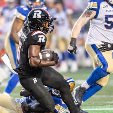 Jun 13, 2024; Ottawa, Ontario, CAN; Ottawa REDBLACKS defenseive back Adarius Pickett (6) is tackled by Winnipeg Blue Bombers running back Johnny Augustine (27) in the first half at TD Place. Mandatory Credit: Marc DesRosiers-Imagn Images