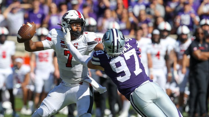 Oct 1, 2022; Manhattan, Kansas, USA; Kansas State Wildcats defensive end Nate Matlack (97) tries to tackle Texas Tech Red Raiders quarterback Donovan Smith (7) during the fourth quarter at Bill Snyder Family Football Stadium. Mandatory Credit: Scott Sewell-USA TODAY Sports