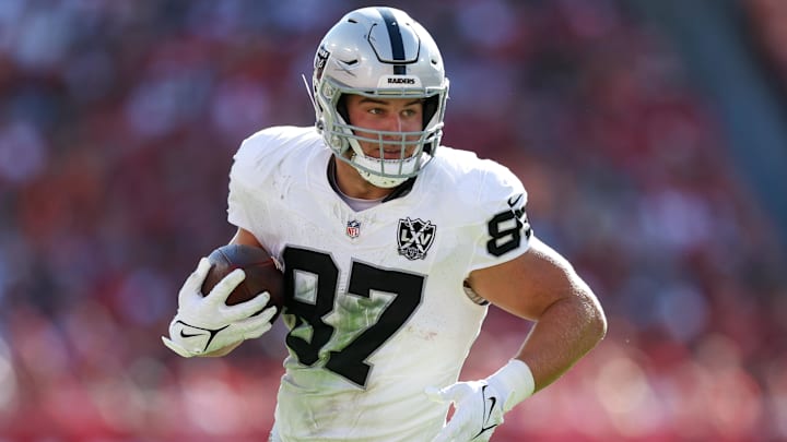 Dec 8, 2024; Tampa, Florida, USA; Las Vegas Raiders tight end Michael Mayer (87) runs with the ball against the Tampa Bay Buccaneers in the second quarter at Raymond James Stadium. Dec 8, 2024; Tampa, Florida, USA; Las Vegas Raiders tight end Michael Mayer (87) runs with the ball against the Tampa Bay Buccaneers in the second quarter at Raymond James Stadium.