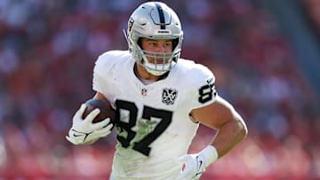 Dec 8, 2024; Tampa, Florida, USA; Las Vegas Raiders tight end Michael Mayer (87) runs with the ball against the Tampa Bay Buccaneers in the second quarter at Raymond James Stadium. Mandatory Credit: Nathan Ray Seebeck-Imagn Images