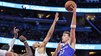 Nov 9, 2025; Orlando, Florida, USA; Orlando Magic forward Franz Wagner (22) shoots against Boston Celtics guard Derrick White (9) during the second half at Kia Center. Mandatory Credit: Mike Watters-Imagn Images