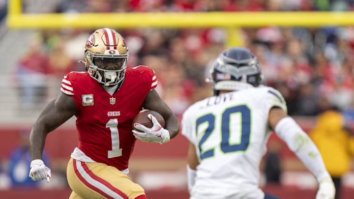 November 17, 2024; Santa Clara, California, USA; San Francisco 49ers wide receiver Deebo Samuel Sr. (1) runs the football against Seattle Seahawks safety Julian Love (20) during the fourth quarter at Levi's Stadium. Mandatory Credit: Kyle Terada-Imagn Images November 17, 2024; Santa Clara, California, USA; San Francisco 49ers wide receiver Deebo Samuel Sr. (1) runs the football against Seattle Seahawks safety Julian Love (20) during the fourth quarter at Levi's Stadium. Mandatory Credit: Kyle Terada-Imagn Images