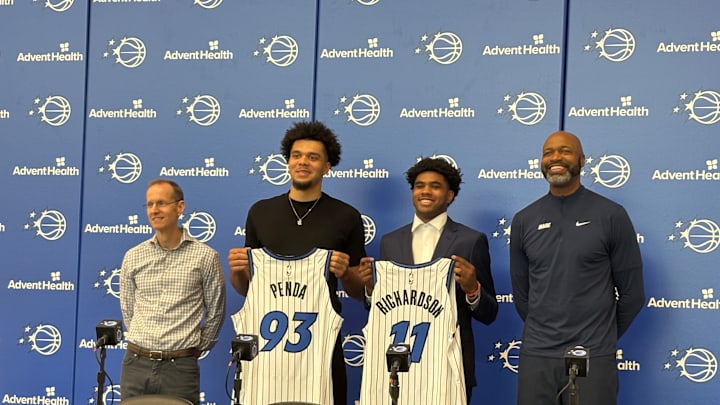 Orlando Magic draft picks Jase Richardson and Noah Penda pose with their jerseys at introductory press conference. 