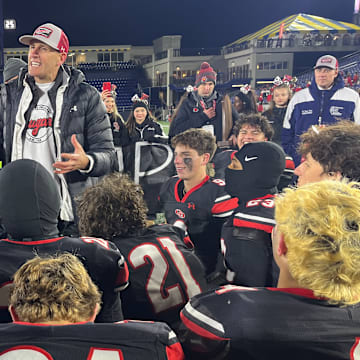 Quince Orchard head football coach John Kelley addresses his team after its victory in the 2024 MPSSAA 4A state championship game.