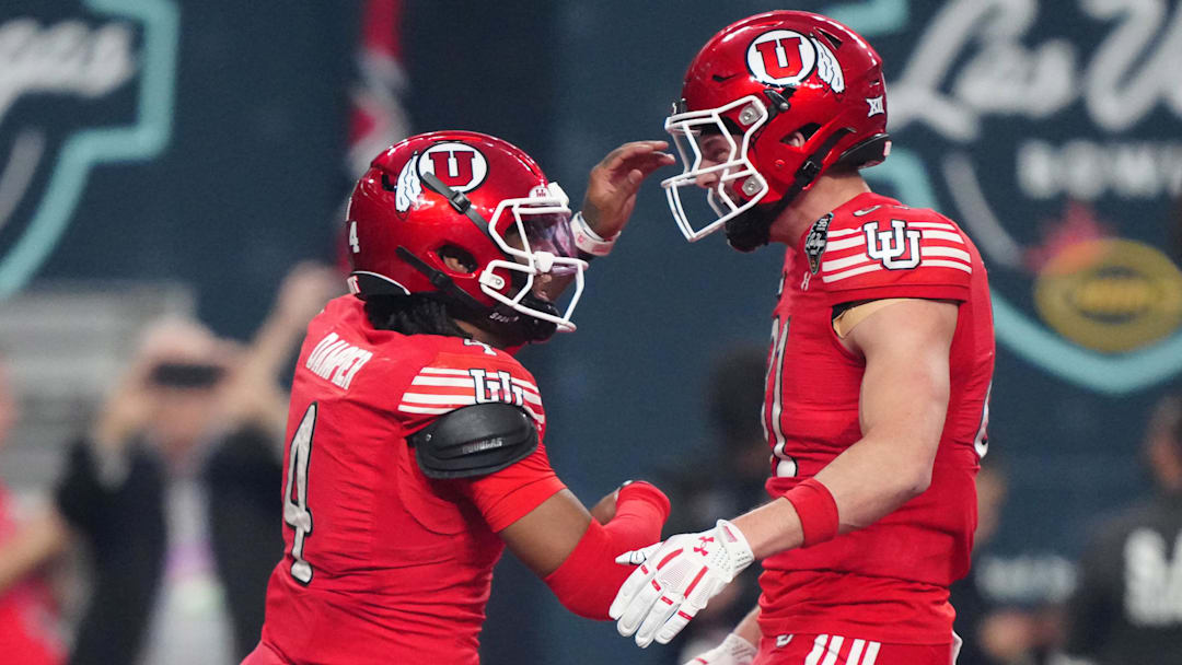 Utah Utes quarterback Devon Dampier (4) and tight end JJ Buchanan (81) celebrate after a touchdown against the Nebraska Cornhuskers in the first half during the SRS Distribution Las Vegas Bowl at Allegiant Stadium.