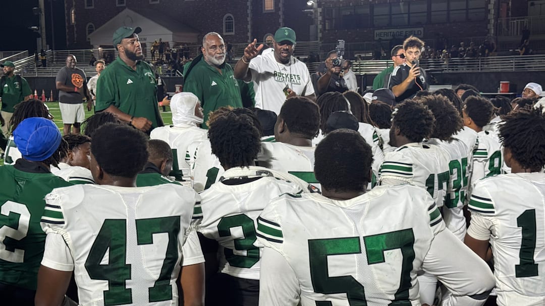 Miami Central coach Derrick Gibson addresses his team after a thrilling comeback victory at American Heritage