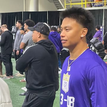 Kamren Fabiculanan shows off his new haircut, no long locks flowing out the back of his helmet.