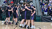 Columbia River players celebrate their Wednesday morning victory against Lakewood in the Class 2A state tournament in the Yakima Valley SunDome.