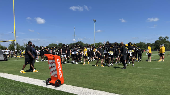 Missouri Tigers players line up for warmups during fall camp practice on Saturday, August 3 in Columbia, Missouri.