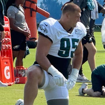 Eagles rookie defensive tackle Ty Robinson gets loose before a training camp practice.