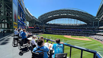 Fans take in a Milwaukee Brewers game from the Miller Lite Landing at American Family Field on May